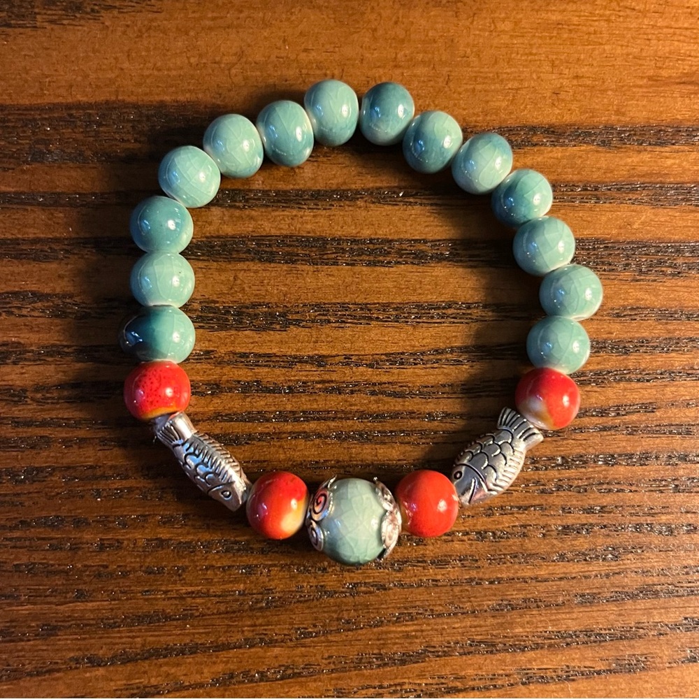 Turquoise-Green and Coral Stretch Beaded Bracelet with Silver Fish Accents